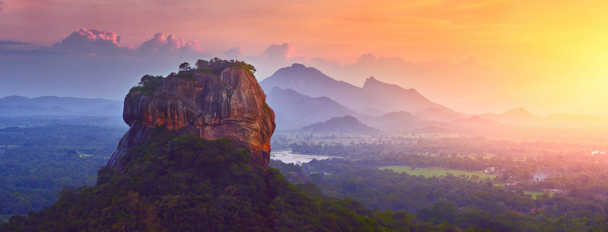 Panoramic view of famous ancient stone fortress Sigiriya (Lion Rock) on island of Sri Lanka.